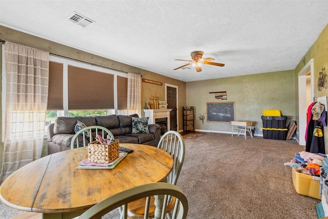 26114 State Highway 19, Cyril, OK 73029 - carpeted dining area with ceiling fan, baseboards, a fireplace, and a textured ceiling