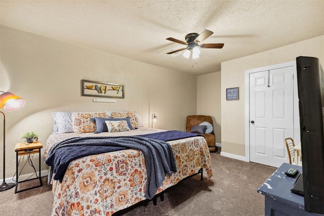 26114 State Highway 19, Cyril, OK 73029 - bedroom with carpet, baseboards, ceiling fan, and a textured ceiling