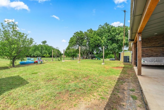 26114 State Highway 19, Cyril, OK 73029 - view of grassy yard with cooling unit