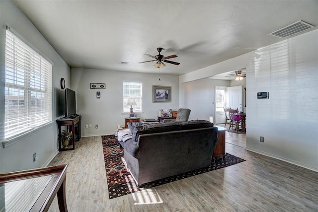 122 Cotton Tail Dr, Shawnee, OK 74804 - living room featuring a ceiling fan, wood finished floors, and healthy amount of natural light