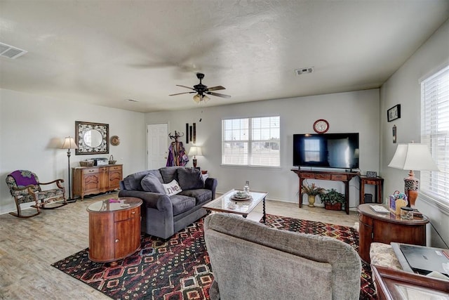 122 Cotton Tail Dr, Shawnee, OK 74804 - living room featuring wood finished floors, plenty of natural light, and a ceiling fan