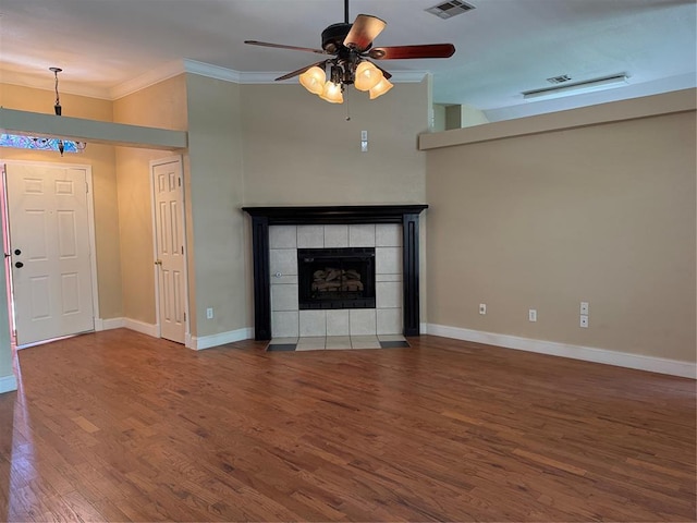 1617 Briarcreek, Norman, OK 73071 - unfurnished living room with wood finished floors, ornamental molding, ceiling fan, baseboards, and a fireplace