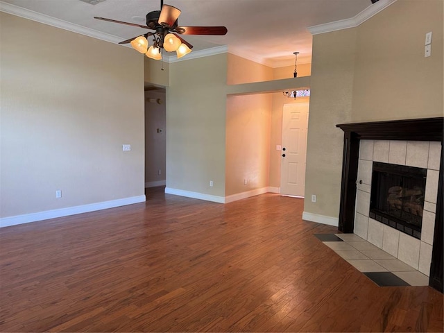 1617 Briarcreek, Norman, OK 73071 - unfurnished living room with ornamental molding, dark wood finished floors, a fireplace, ceiling fan, and baseboards