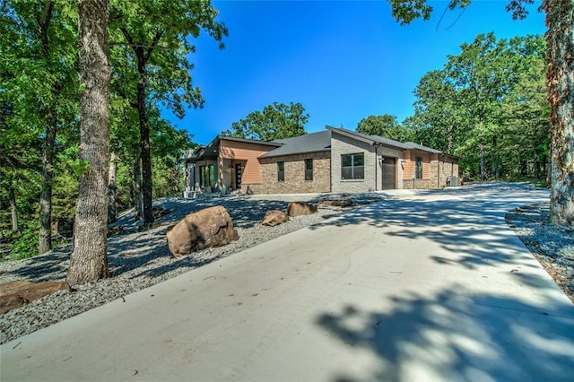 118289 S 4215th Rd, Eufaula, OK 74432 - mid-century home featuring an attached garage, driveway, and brick siding