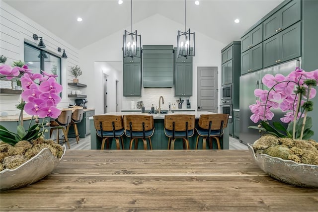 118289 S 4215th Rd, Eufaula, OK 74432 - kitchen featuring a chandelier, light countertops, a sink, green cabinets, and high vaulted ceiling