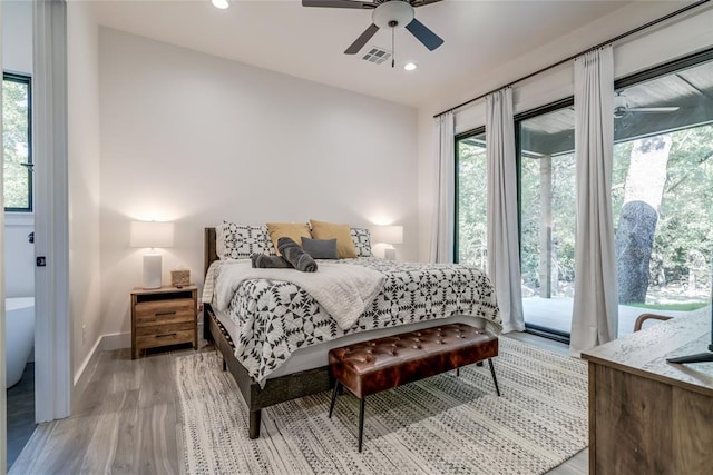 118289 S 4215th Rd, Eufaula, OK 74432 - bedroom featuring access to outside, multiple windows, light wood-type flooring, baseboards, and recessed lighting