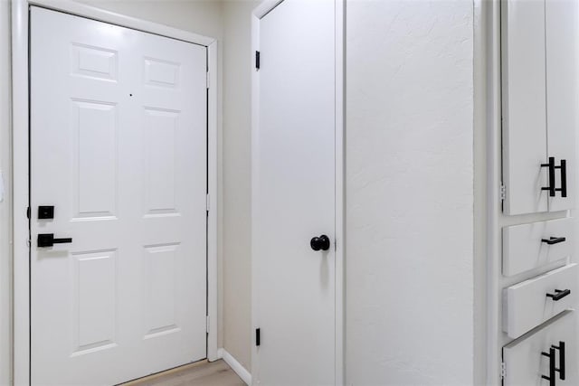 444 NW 86th St, Oklahoma City, OK 73114 - hallway featuring light wood finished floors