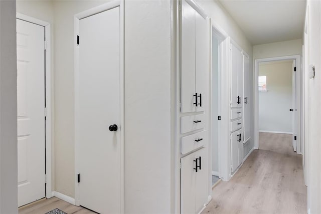 444 NW 86th St, Oklahoma City, OK 73114 - hallway with light wood-type flooring and baseboards