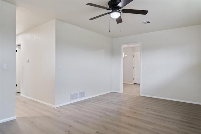 444 NW 86th St, Oklahoma City, OK 73114 - unfurnished room with wood finished floors, ceiling fan, and baseboards