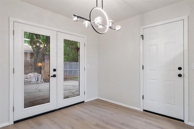 444 NW 86th St, Oklahoma City, OK 73114 - doorway featuring a chandelier, light wood-type flooring, french doors, and baseboards