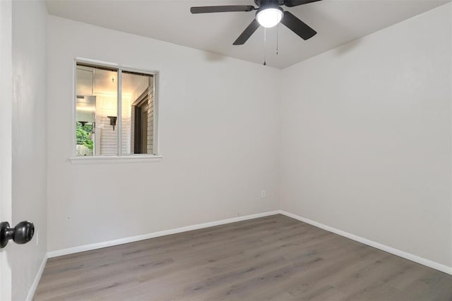 444 NW 86th St, Oklahoma City, OK 73114 - spare room featuring wood finished floors, baseboards, and ceiling fan