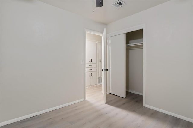 444 NW 86th St, Oklahoma City, OK 73114 - unfurnished bedroom featuring baseboards, wood finished floors, a closet, and a ceiling fan