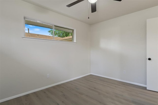 444 NW 86th St, Oklahoma City, OK 73114 - unfurnished room with wood finished floors, baseboards, and a ceiling fan