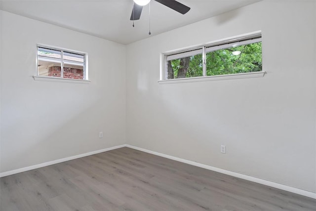 444 NW 86th St, Oklahoma City, OK 73114 - spare room with healthy amount of natural light, wood finished floors, baseboards, and a ceiling fan