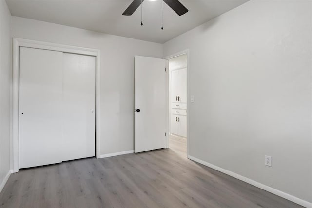 444 NW 86th St, Oklahoma City, OK 73114 - unfurnished bedroom featuring wood finished floors, baseboards, and a closet