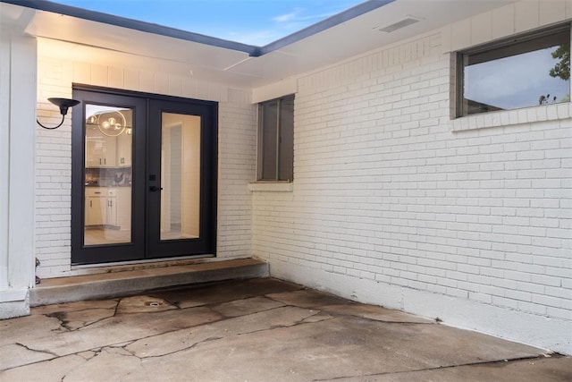 444 NW 86th St, Oklahoma City, OK 73114 - property entrance featuring french doors and brick siding