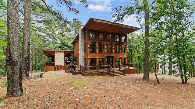 136 Gnarly Maple Trl, Broken Bow, OK 74728 - back of house featuring a deck