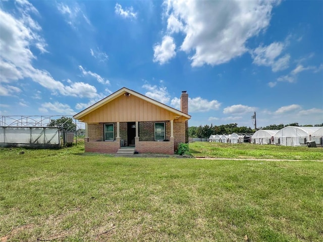 8701 Cornforth Rd, Guthrie, OK 73044 - view of front facade featuring a chimney and brick siding