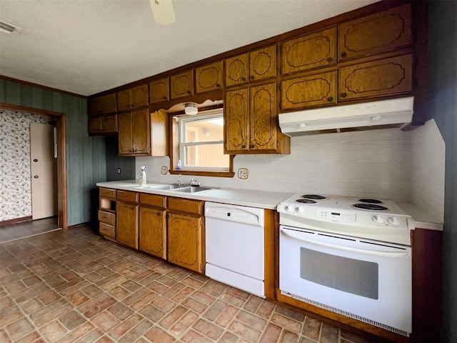 8701 Cornforth Rd, Guthrie, OK 73044 - kitchen with white appliances, under cabinet range hood, brick patterned flooring, a sink, and light countertops