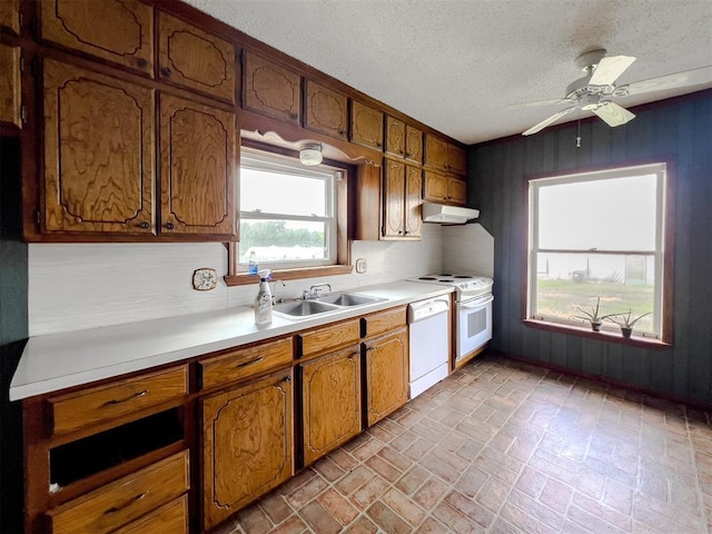 8701 Cornforth Rd, Guthrie, OK 73044 - kitchen with white appliances, a sink, brick patterned flooring, light countertops, and under cabinet range hood