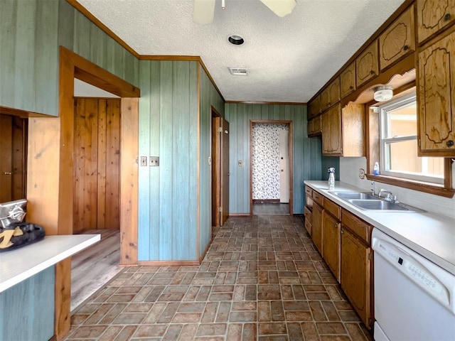8701 Cornforth Rd, Guthrie, OK 73044 - kitchen with white dishwasher, a sink, ornamental molding, brick flooring, and light countertops