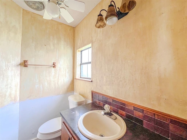 8701 Cornforth Rd, Guthrie, OK 73044 - half bathroom with vanity, toilet, tasteful backsplash, and ceiling fan