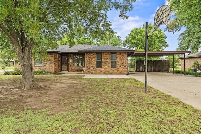 720 W 3rd St, Watonga, OK 73772 - single story home with an attached carport, concrete driveway, and brick siding