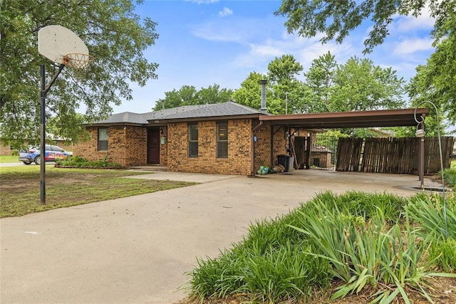 720 W 3rd St, Watonga, OK 73772 - view of front of house featuring a carport and concrete driveway