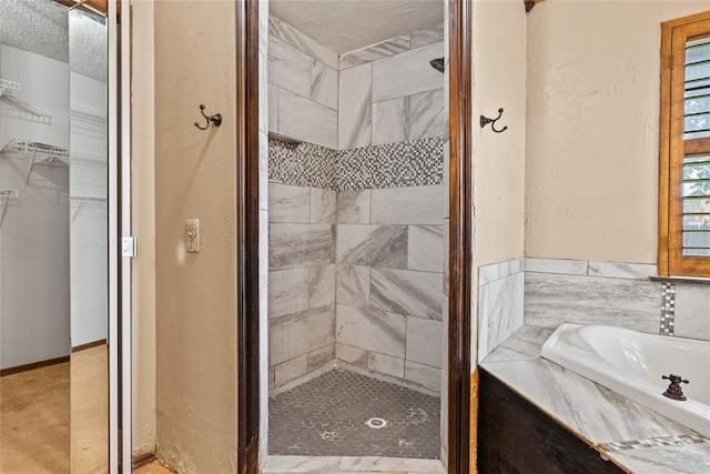 720 W 3rd St, Watonga, OK 73772 - full bath featuring a garden tub, a shower stall, and a walk in closet