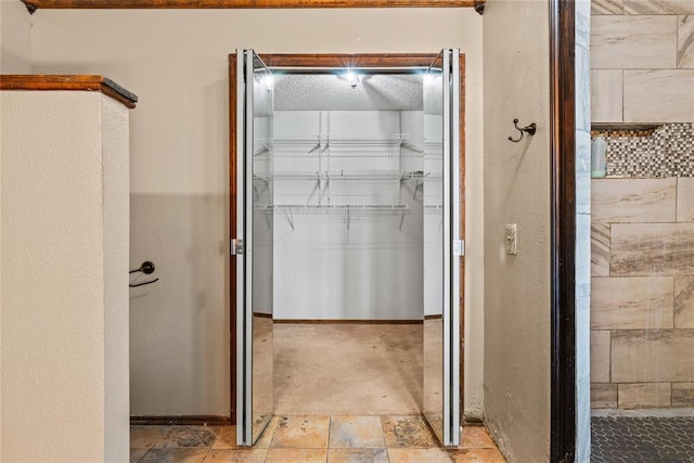 720 W 3rd St, Watonga, OK 73772 - bathroom with a walk in closet