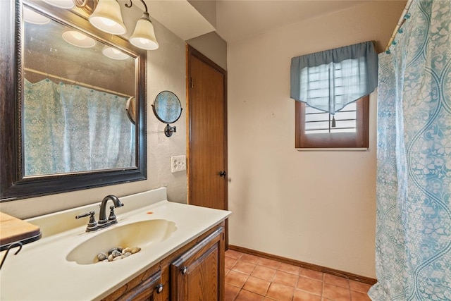 720 W 3rd St, Watonga, OK 73772 - bathroom with vanity, tile patterned flooring, and baseboards