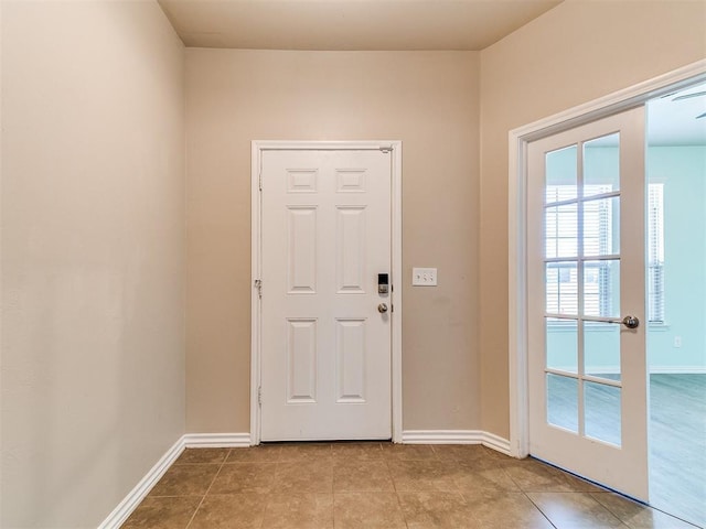 9708 Squire Ln, Yukon, OK 73099 - doorway featuring baseboards and tile patterned floors
