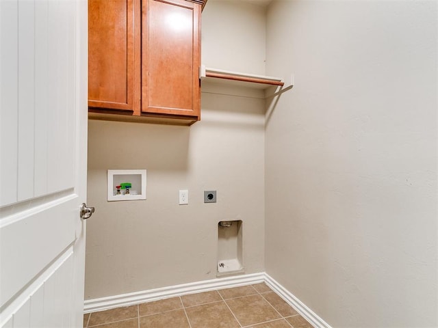 9708 Squire Ln, Yukon, OK 73099 - washroom with hookup for an electric dryer, cabinet space, hookup for a washing machine, and tile patterned flooring