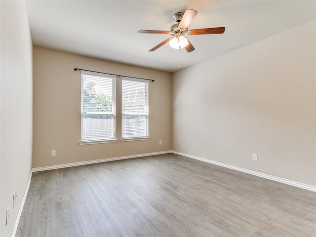 9708 Squire Ln, Yukon, OK 73099 - empty room with wood finished floors and ceiling fan
