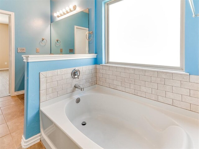 9708 Squire Ln, Yukon, OK 73099 - bathroom featuring a garden tub and tile patterned floors