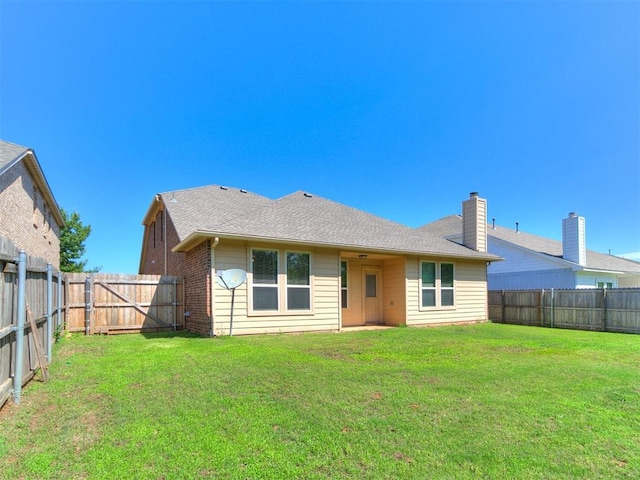 9708 Squire Ln, Yukon, OK 73099 - back of property featuring a fenced backyard and a chimney