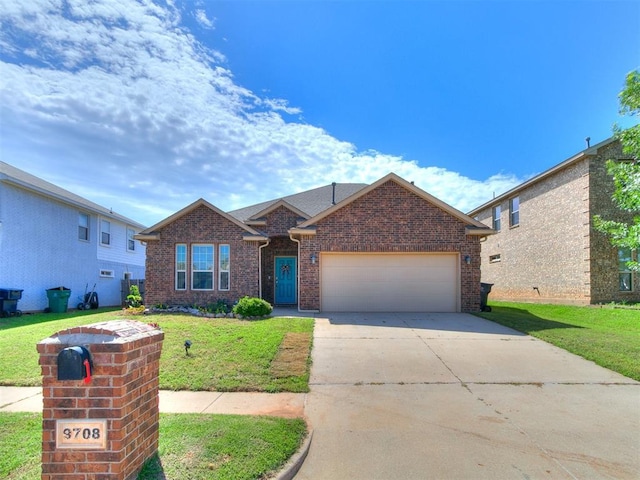9708 Squire Ln, Yukon, OK 73099 - view of front facade with brick siding, a front yard, an attached garage, and concrete driveway