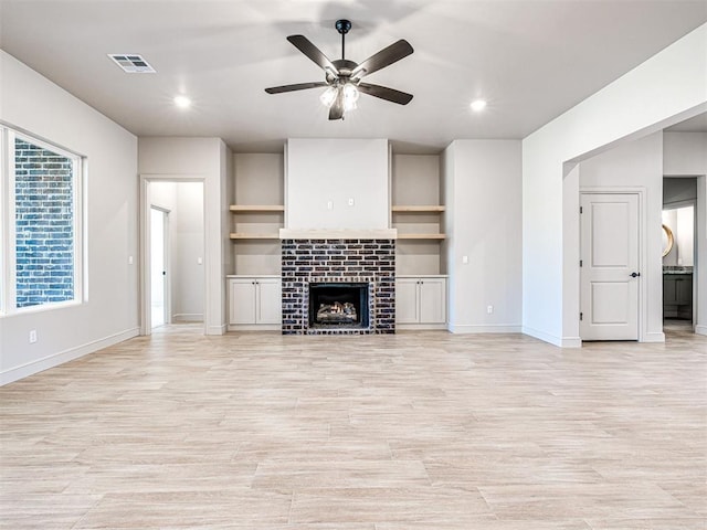 9608 Sultans Water Way, Yukon, OK 73099 - unfurnished living room featuring a ceiling fan, light wood-type flooring, a brick fireplace, baseboards, and recessed lighting