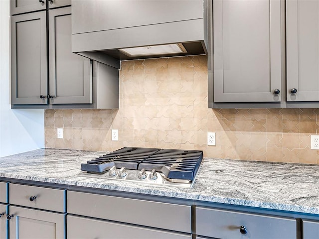 9608 Sultans Water Way, Yukon, OK 73099 - kitchen featuring gray cabinetry, extractor fan, and stainless steel gas cooktop