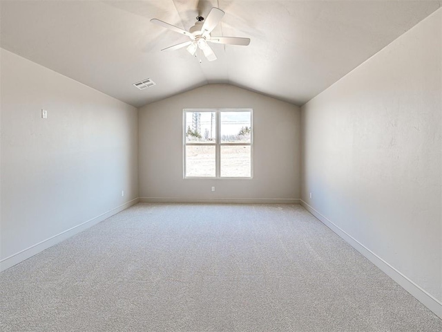 9608 Sultans Water Way, Yukon, OK 73099 - additional living space with vaulted ceiling, a ceiling fan, light carpet, and baseboards