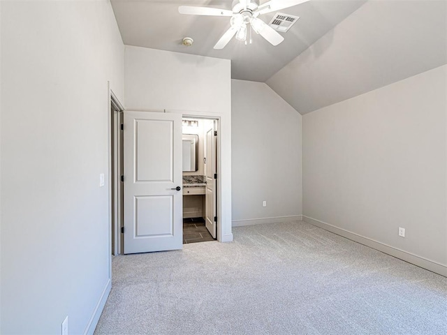 9608 Sultans Water Way, Yukon, OK 73099 - unfurnished bedroom featuring carpet, lofted ceiling, baseboards, ensuite bathroom, and a ceiling fan