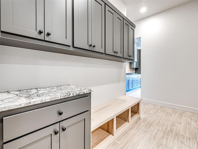 9608 Sultans Water Way, Yukon, OK 73099 - mudroom with light wood finished floors, baseboards, and recessed lighting