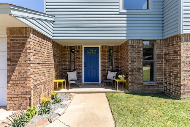 7921 NW 40th St, Bethany, OK 73008 - property entrance with brick siding, a porch, and a yard