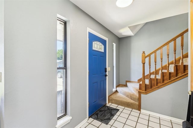 7921 NW 40th St, Bethany, OK 73008 - entryway featuring stairway, light tile patterned flooring, and baseboards