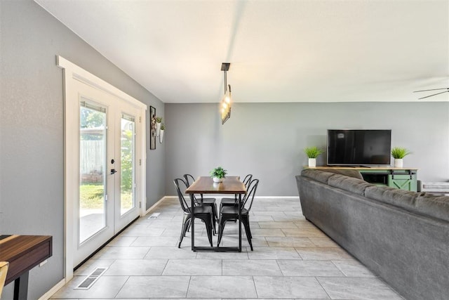 7921 NW 40th St, Bethany, OK 73008 - dining area featuring french doors, a ceiling fan, and baseboards
