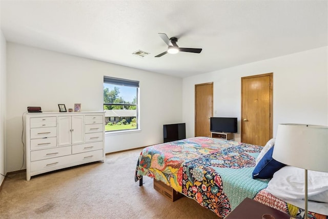7921 NW 40th St, Bethany, OK 73008 - bedroom with light colored carpet, baseboards, and a ceiling fan