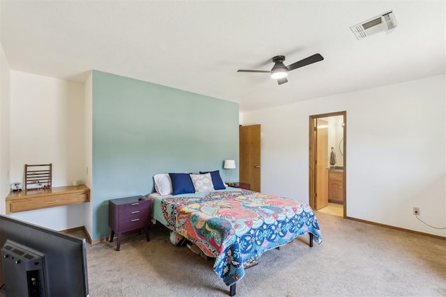 7921 NW 40th St, Bethany, OK 73008 - carpeted bedroom featuring baseboards, a ceiling fan, and ensuite bath