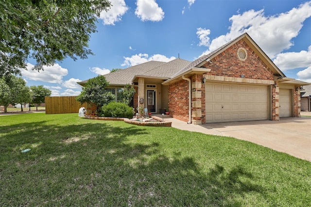 17401 White Hawk Dr, Edmond, OK 73012 - view of front of house with an attached garage, driveway, brick siding, and roof with shingles