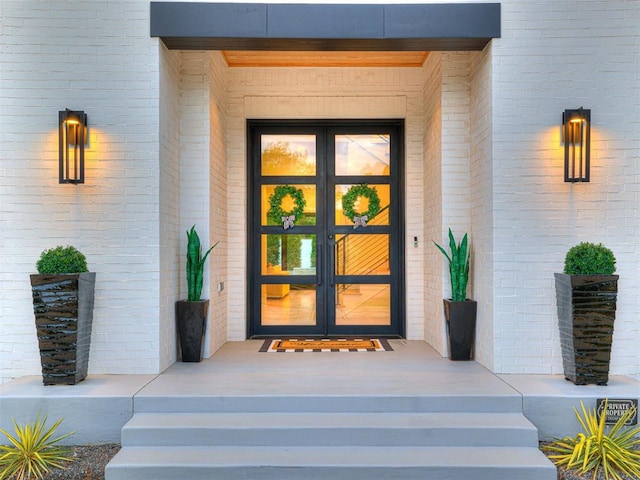 15825 Lacebark Ln, Edmond, OK 73013 - view of exterior entry with french doors and brick siding