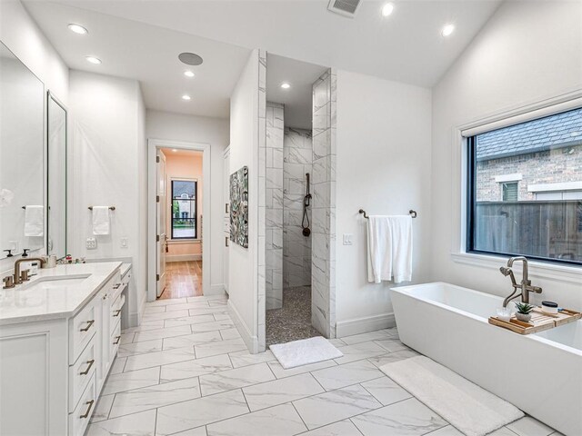 15825 Lacebark Ln, Edmond, OK 73013 - full bathroom with a freestanding tub, vanity, marble finish floors, recessed lighting, and walk in shower